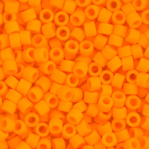 Close-up of Miyuki Delica 11/0 DB1583 cylinder beads in matte orange mandarin