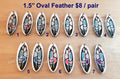 Seven pairs of 1.5 inch oval Coastal feather cabochons (cabs) in black and silver with coloured accents