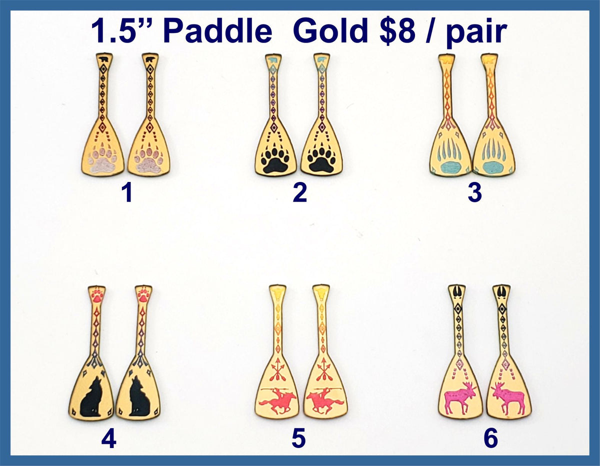 Gold acrylic paddle cabs, six pairs with paw, wolf, turtle, moose and horse rider designs
