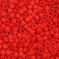 Close-up of Miyuki Delica 11/0 cylinder beads in a red vermillion shade