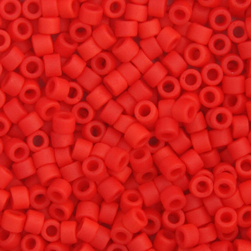 Close-up of Miyuki Delica 11/0 cylinder beads in a red vermillion shade