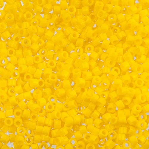 Close-up of Miyuki Delica 11/0 DB1132 cylinder beads in opaque yellow canary