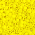 Close-up of Miyuki Delica 11/0 DB0751 cylinder beads in matte yellow