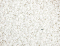 Close-up of Miyuki Delica 11/0 DB0351 cylinder beads in matte white